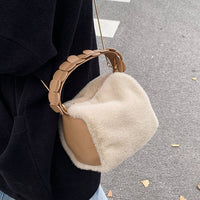 Small furry crossbody hand bag from Spacewallart featuring a soft, plush exterior and adjustable strap, ideal for accessories.