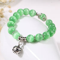 Natural opal beads bracelet featuring colorful, iridescent stones on an elegant accessory from Spacewallart.