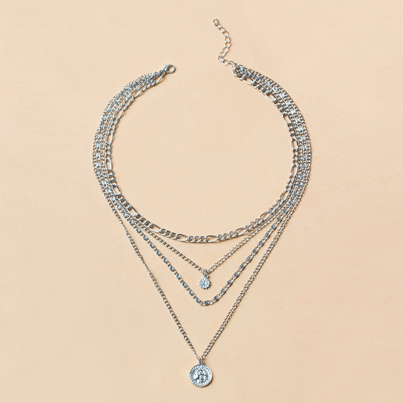 Close-up of a chunky gold necklace from Spacewallart, showcasing its bold, textured chain design in a stylish accessories image.