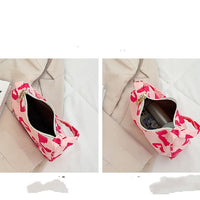 Korean street trend hand-carried bag by Spacewallart featuring vibrant patterns and a stylish, casual accessory design.