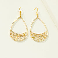 Simple geometric earrings by Spacewallart featuring minimalist shapes and silver-toned metal, displayed on a plain white background.