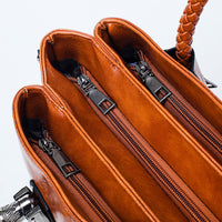 Vintage oil wax leather handbag by Spacewallart, luxury leather accessory with a classic design and textured finish.