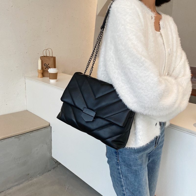 Small PU leather crossbody bag from Spacewallart, featuring a compact design with adjustable strap and sleek finish.
