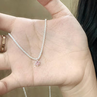 Mini Starry Necklace by Spacewallart featuring a delicate chain with tiny star-shaped charms, perfect as stylish accessories.