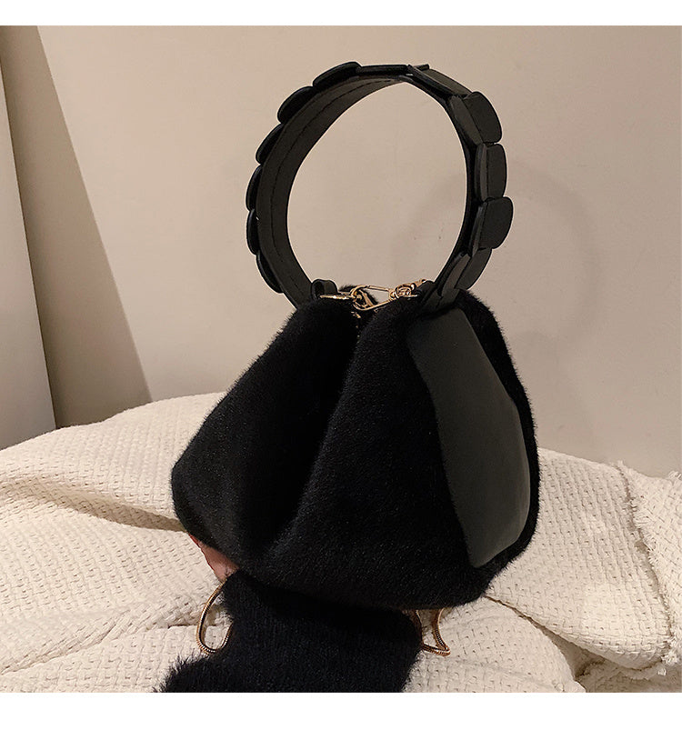 Small furry crossbody handbag by Spacewallart featuring soft plush material and a compact, stylish accessory for everyday wear.