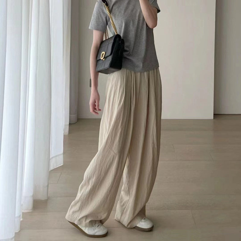 Spacewallart loose wide-leg pants with a tight waistband, flowing and comfortable for casual or stylish wear.