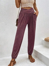 Casual loose ankle-tied trousers with pockets by Spacewallart, featuring a relaxed fit and stylish design.
