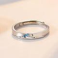 Pair of matching couple's rings from Spacewallart, silver-toned accessories with engraved details, displayed on a neutral background.