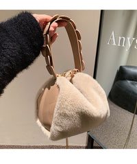 Small furry crossbody handbag by Spacewallart featuring soft plush fabric and a compact, stylish design for accessories.