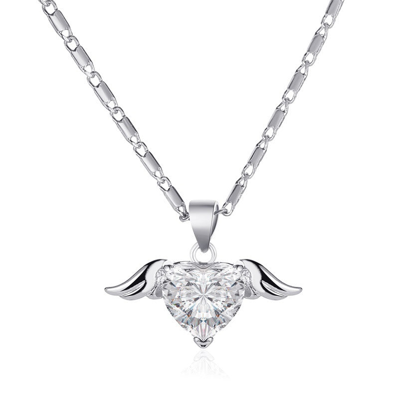 Spacewallart Heart Wings Necklace featuring a silver heart with wing accents, stylish accessories for a unique look.