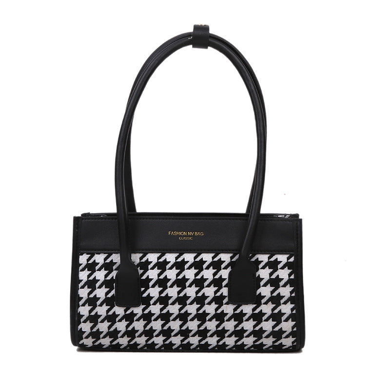 Spacewallart plaid hand carry bag featuring a versatile design with a stylish plaid pattern and sturdy handle for accessories.
