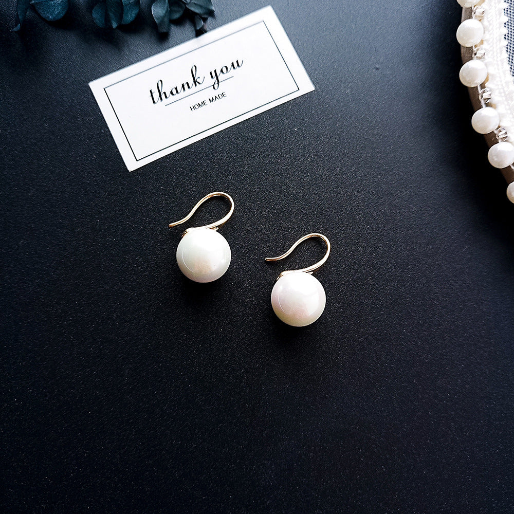 Simple pearl earrings from Spacewallart, featuring classic white pearls and a sleek, minimalist design for elegant accessories.