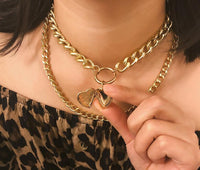 Metal heart choker necklace from Spacewallart, stylish accessories with a sleek metallic heart pendant on a black band.