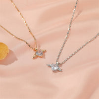 Spacewallart Heart Wings Necklace, delicate accessories with a heart and wing design, featuring intricate metal detailing.