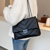 Small PU leather crossbody bag by Spacewallart featuring a compact design and adjustable strap, perfect for everyday accessories.