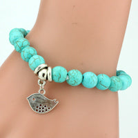 Vintage turquoise bracelet from Spacewallart, featuring vibrant turquoise stones and intricate accessory design.