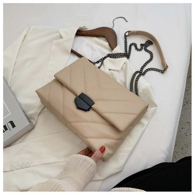 Small PU leather crossbody bag by Spacewallart, compact accessory with adjustable strap and stylish design.