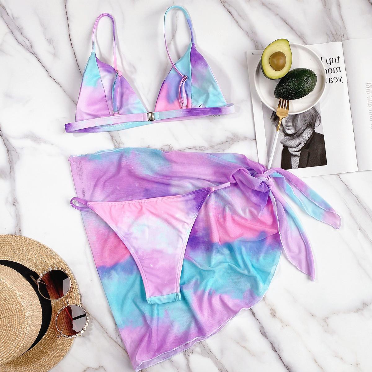 Spacewallart triangle micro bikini set swimwear featuring a minimal triangle top and matching bottoms on a model.