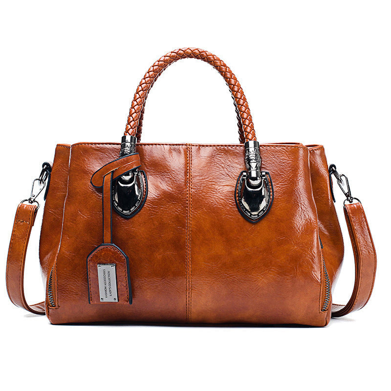Vintage oil wax leather handbag by Spacewallart, luxury accessory with textured leather and classic design.