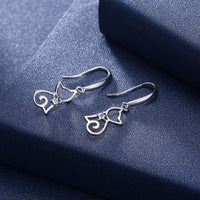 Sterling silver cat zircon earrings with detailed feline design, perfect accessories for animal lovers or elegant jewelry.