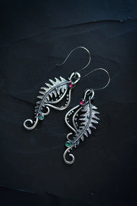 Gold tail-shaped earrings from Spacewallart accessories collection, featuring sleek, curved design for stylish wear.