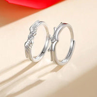 Flying Couple Rings by Spacewallart, elegant silver accessories featuring intertwined flying couple design on smooth band