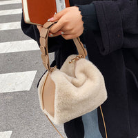 Small furry crossbody handbag by Spacewallart, featuring soft plush fabric, compact design, and adjustable strap for accessories.