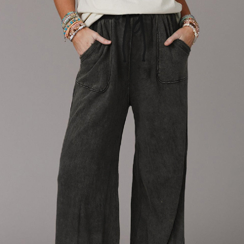 Light blue washed drawstring casual pants by Spacewallart, featuring a relaxed fit and comfortable waistband for everyday wear.