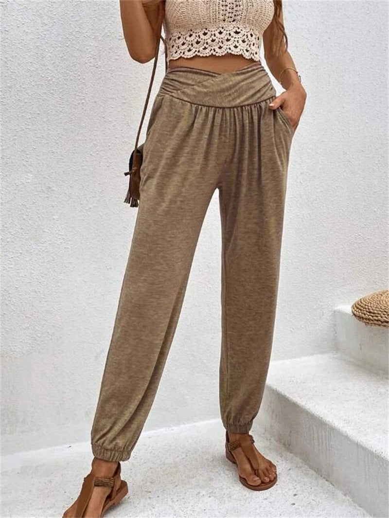 Spacewallart casual loose pocket ankle-tied trousers, showing relaxed fit with side pockets and ankle tie details.