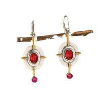Retro oval earrings by Spacewallart featuring smooth, shiny metal with a vintage-inspired oval shape accessory.