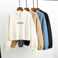 Spacewallart Axe Hoodie, casual apparel with bold design, shown hanging on a wooden hanger against a neutral background.