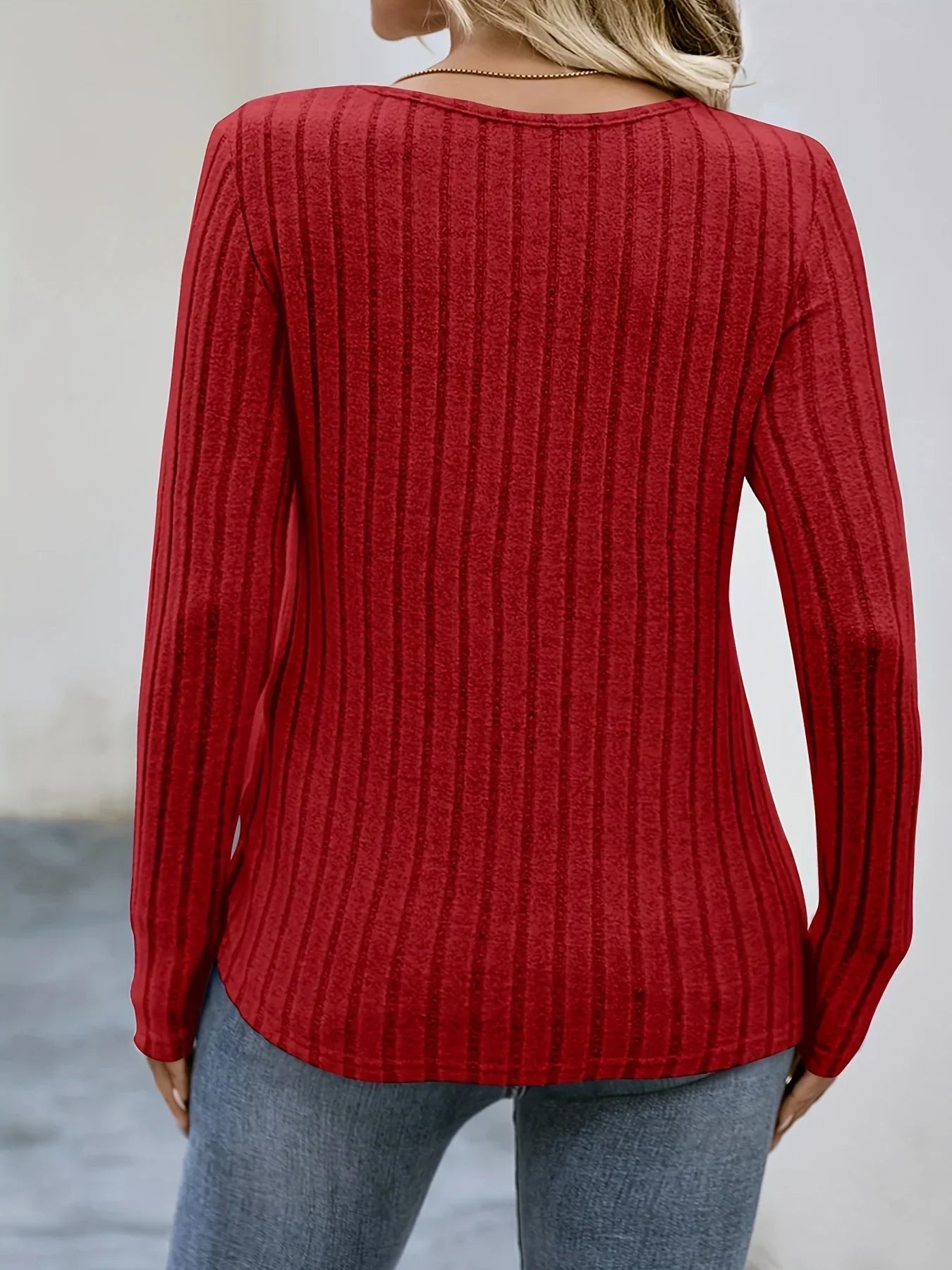 Spacewallart NEMI sweater, cozy knit apparel with a stylish design, shown in a close-up of the front view.