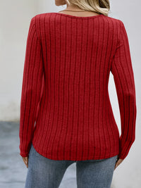 Spacewallart NEMI sweater, cozy knit apparel with a stylish design, shown in a close-up of the front view.