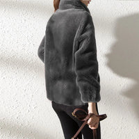 Spacewallart FASHI HOODIE in black, casual apparel with front pocket and drawstring hood, displayed on a hanger.