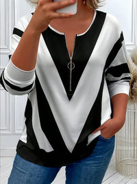 Spacewallart BERI sweater, cozy knit apparel in neutral tones, shown on a hanger with a textured background.