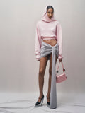 Spacewallart Musa denim shorts skirt displayed on a hanger, showcasing its casual, stylish design perfect for spring and summer.