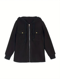Spacewallart DEFI jacket, stylish black apparel with modern design, displayed on a hanger against a neutral background.