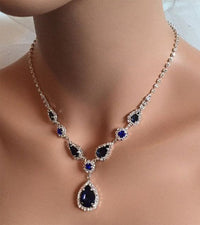 Blue zirconia necklace from Spacewallart featuring a delicate chain and a sparkling blue zirconia pendant.