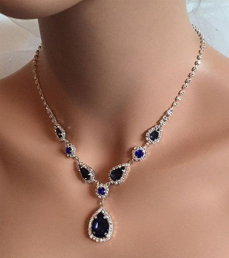 Blue zirconia necklace from Spacewallart featuring a delicate chain and a sparkling blue zirconia pendant.