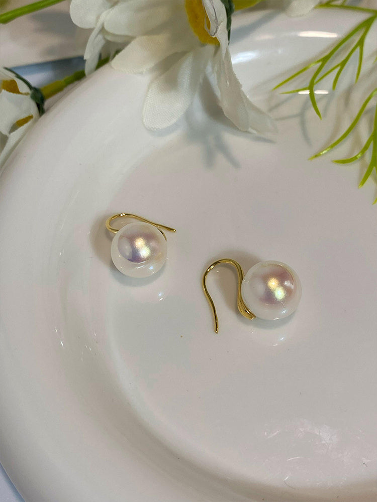 Simple pearl earrings by Spacewallart, featuring classic white pearls on delicate silver hooks for elegant accessories.