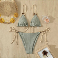 Solid color strap bikini top and bottom swimsuits from Spacewallart, showcasing vibrant, matching swimwear pieces on a mannequin.