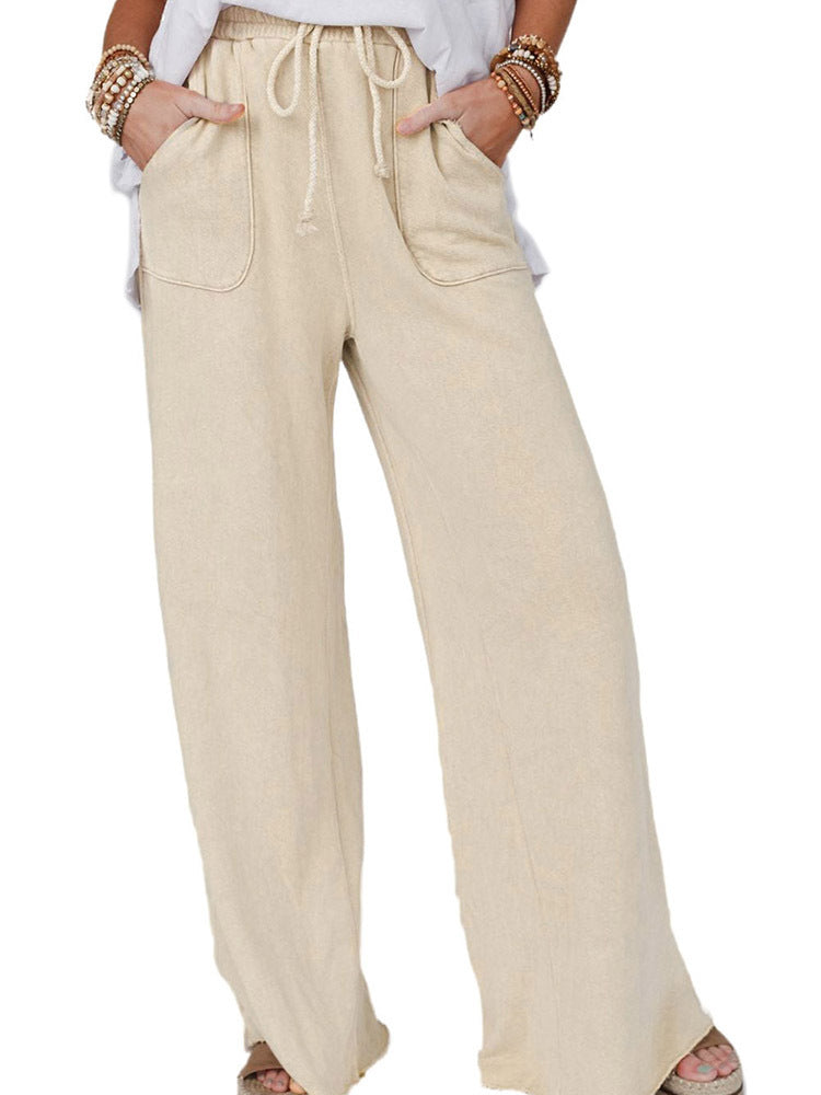 Light blue washed casual pants with drawstring waist from Spacewallart, displayed flat on a white background.