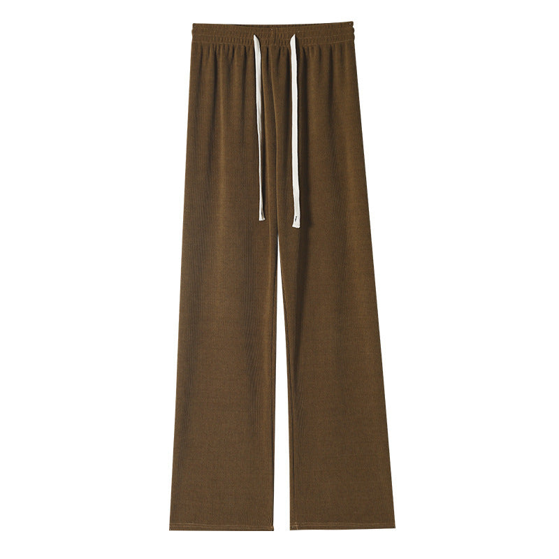 Makaron knitted wide-leg pants by Spacewallart displayed on a hanger, showcasing the textured, loose-fitting design of the apparel.