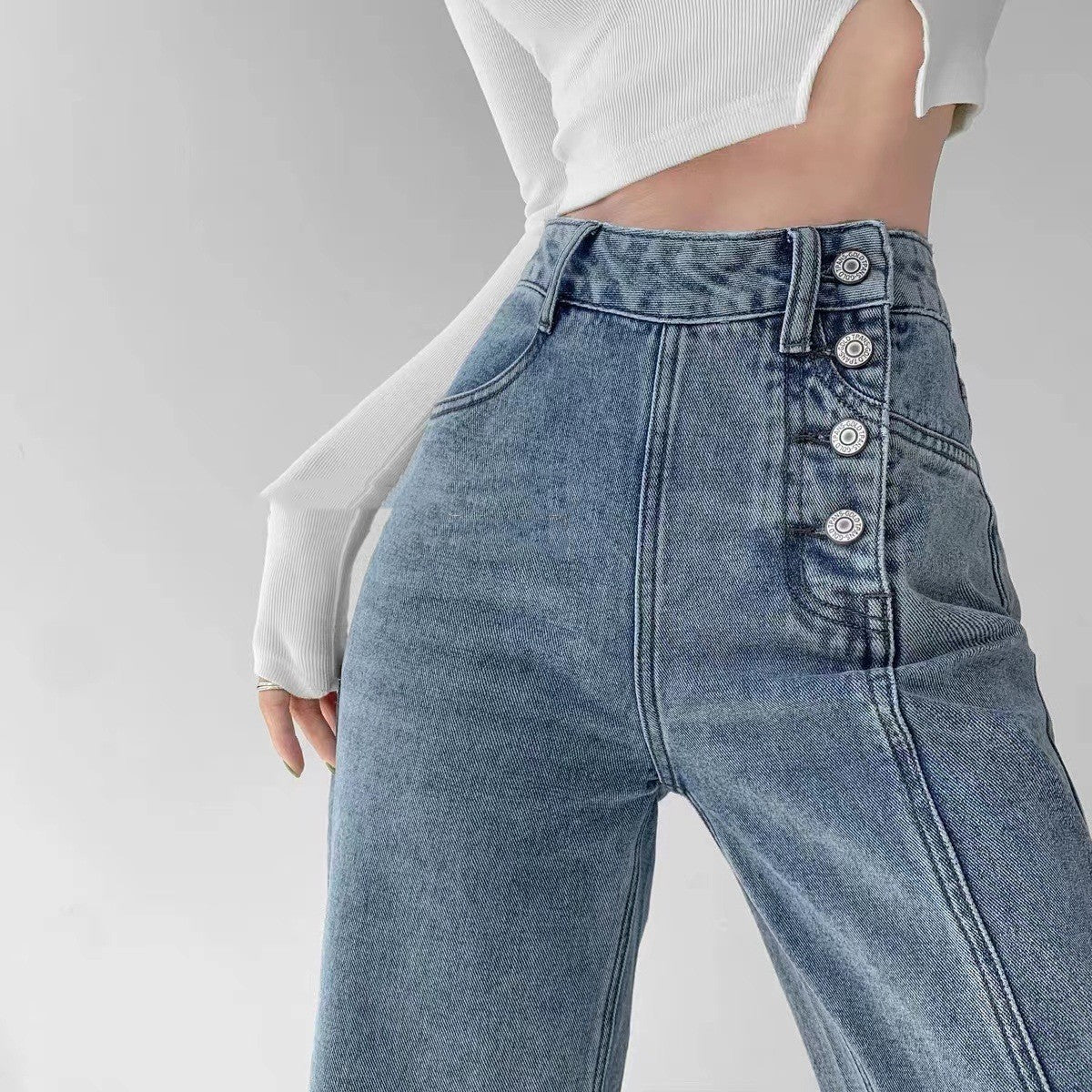 Spacewallart irregular breasted high waist jeans, denim apparel featuring unique design and high-rise fit, shown on a model.