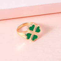 Four leaf clover rings from Spacewallart accessories, featuring silver bands with four leaf clover charms, on a white background.