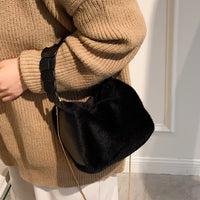 Small furry crossbody handbag from Spacewallart, featuring soft plush material and a compact design for stylish accessories.