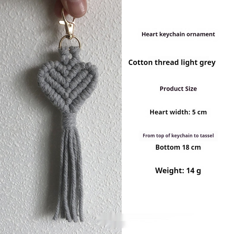 Hand-woven key accessories by Spacewallart, a creative small gift, featuring colorful, intricate designs on a keychain or keyring.