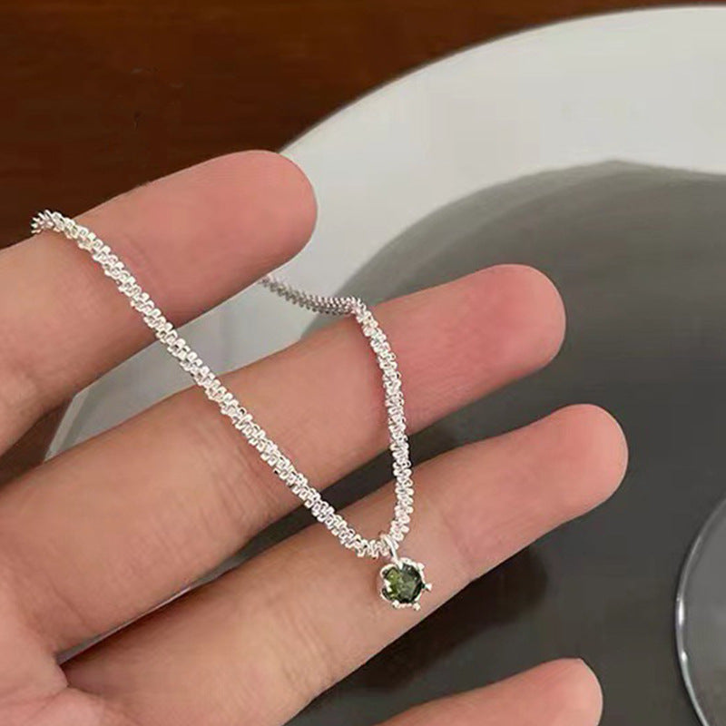 Mini Starry Necklace by Spacewallart featuring delicate star-shaped charms on a fine chain.