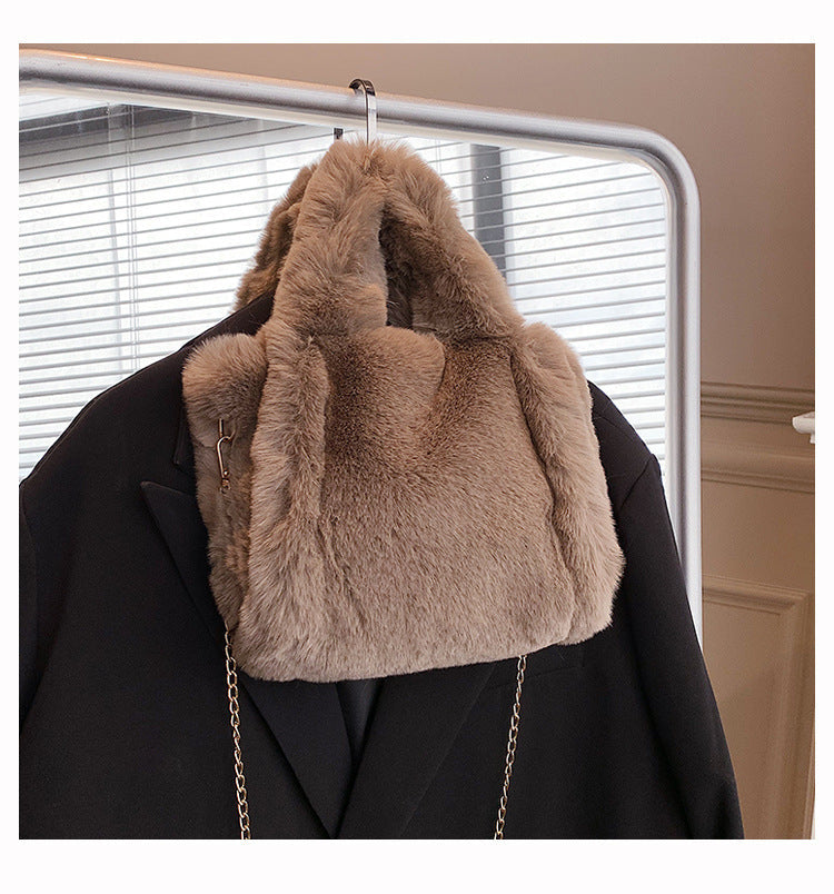 Chain plush handbag by Spacewallart featuring a soft, textured plush exterior and a stylish chain strap for accessories.