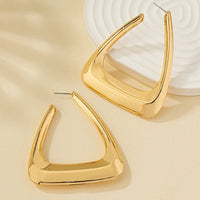 Silver metal earrings for women, stylish accessory by Spacewallart, featuring sleek, modern design on a neutral background.